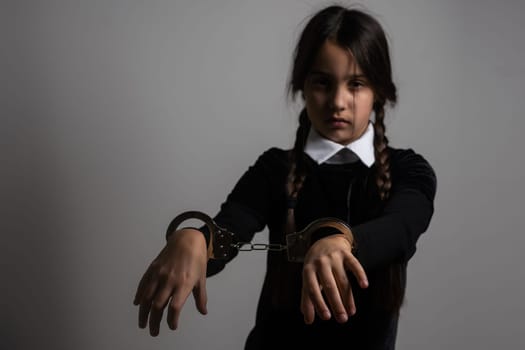 Wednesday Addams. Gothic girl with handcuff.
