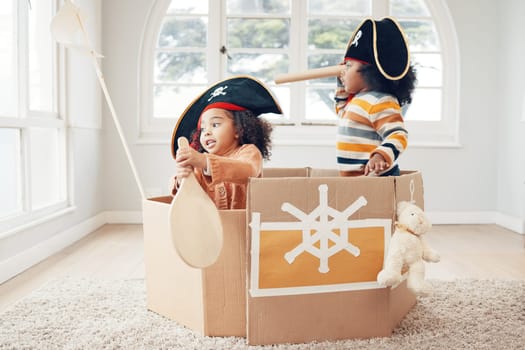 Playing, box boat and pirate children role play, fantasy imagine or pretend in cardboard container. Telescope, fun home game or sailing black kids on Halloween cruise adventure with yacht captain.