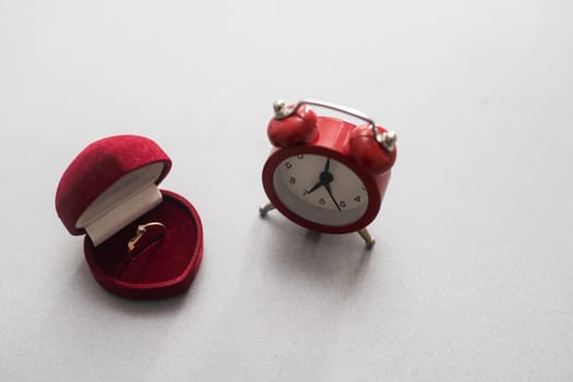 Wedding rings and alarm clock, wedding time concept