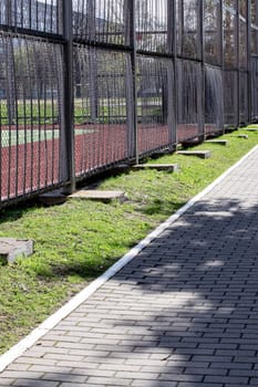 Tile alley in the park in sunlight close up