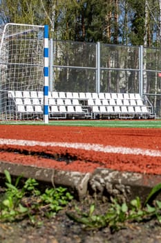 Soccer field with green grass and a treadmill close up