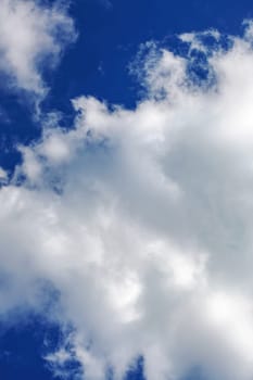 Big white cloud in the blue sky close up