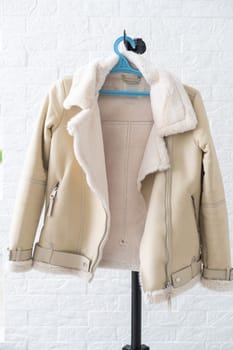 women's jacket on a hanger white background.