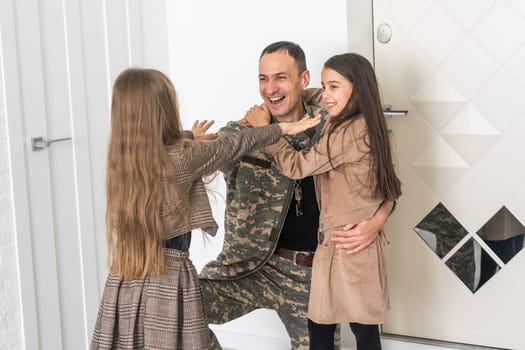 Happy military father holding daughter. family, bonding and patriotism,