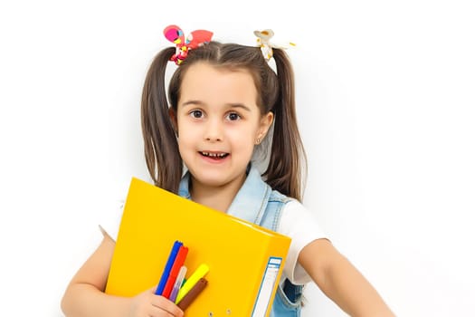 happy sweet little school girl carrying schoolbag backpack and books smiling in education and back to school concept isolated on white background