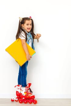 Cute girl on roller skates against white background