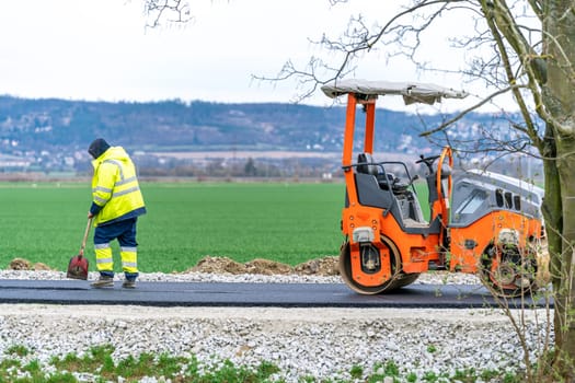roller for asphalt compaction during the construction of a new road and traffic communication. High quality photo