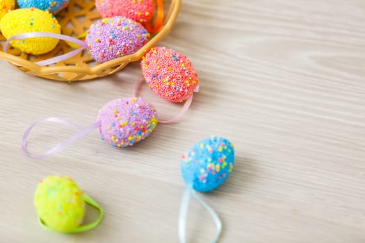 Easter eggs painted in pastel colors on a white background