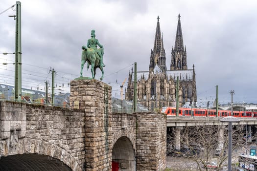 Cologne, Germany - March 23, 2023: Cathedral of St. Peter and Mary, Equestrian statue of Emperor William, main station.