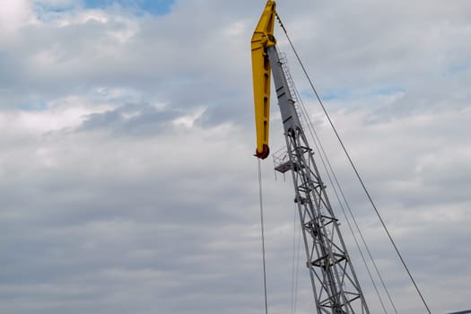 Luffing crane against of blue sky. High quality photo