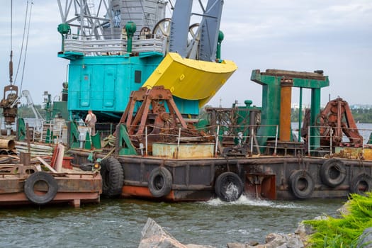 Luffing crane at the barge on water. High quality photo