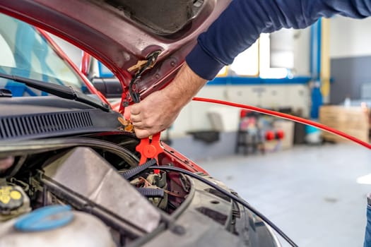 starting the car engine using the starter cable.
