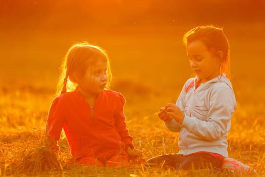 Beautiful little girls enjoying outside.