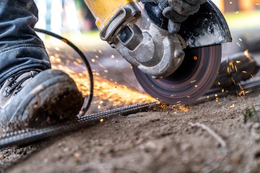 cutting iron fittings with a grinder.