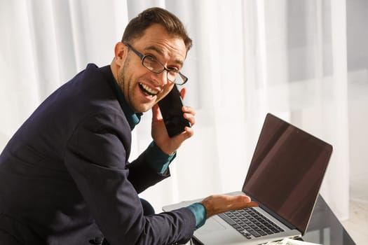 Business man working at office with laptop and documents on his desk, consultant lawyer concept