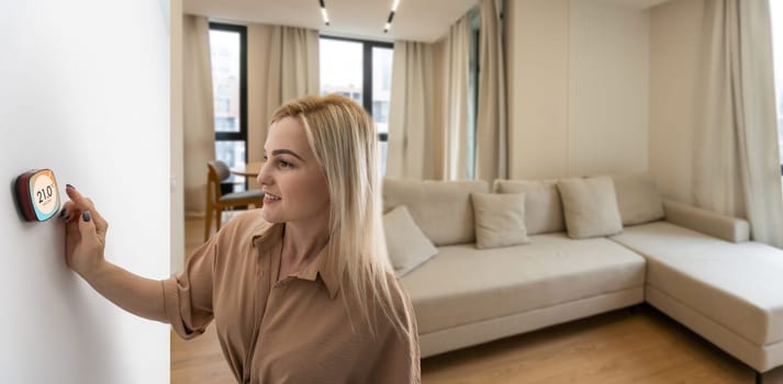 Woman pressing on smart home automation panel monitor.