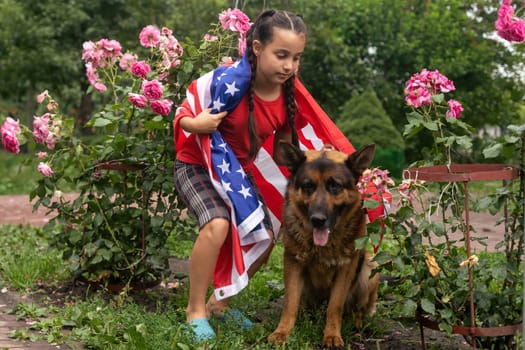 Happy little girl patriot running in the field with American flag. USA celebrate 4th of July. High quality photo