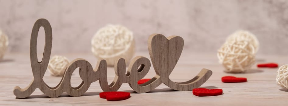 Banner Wooden word love with heart romance. Minimal concept of greeting card for Valentine's Day, Mother's Day, Women's Day Festive holiday card concept. Wedding anniversary decor.