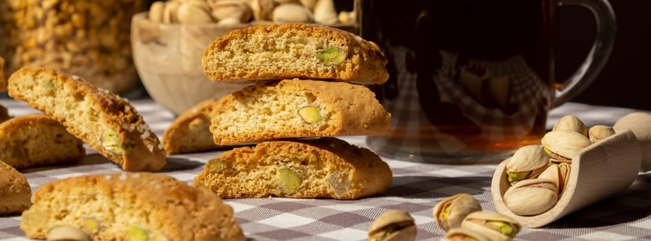 Biscotti Cantuccini Cookie Biscuits with pistachios and lemon peel Shortbread. Cup of tea. Teatime break Healthy eating food. Homemade fresh Italian cookies cantucci stacks and organic pistachios nuts. Vegan dieting vegetarian. Nutrition