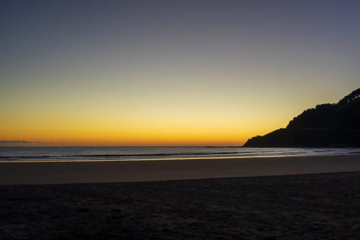 Sandy beach on the Atlantic Ocean, Basque Country sunset time , Spain.