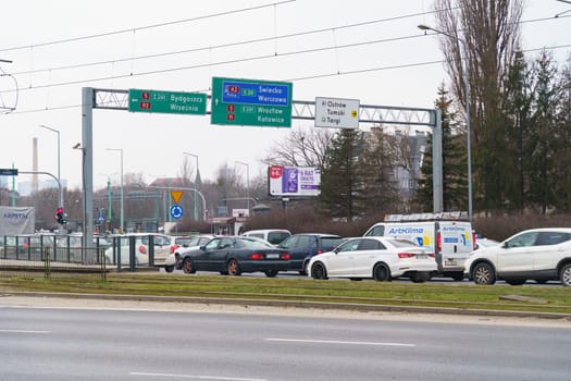 Poznan, Poland - February 4, 2023: City street during peak hours. Cars on the highway.