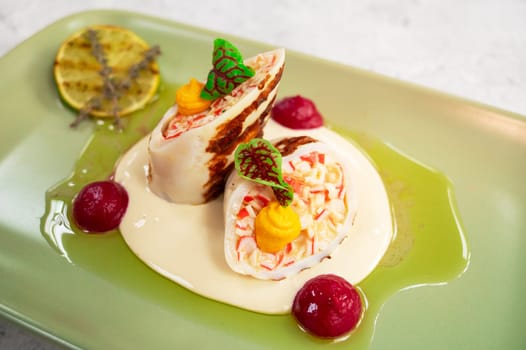 Squid stuffed with crab meat and cheese closeup dish