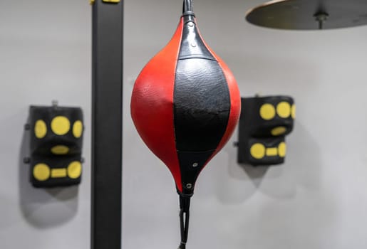 A closeup of a boxing punching bag in the sports complex