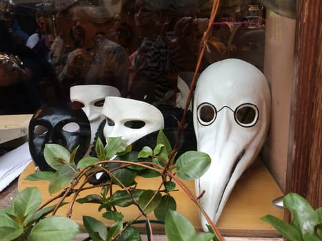 Venetian carnival masks in a shop window. High quality photo