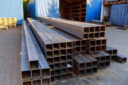 Metal profile pipe of rectangular cross section in packs at the warehouse of metal products