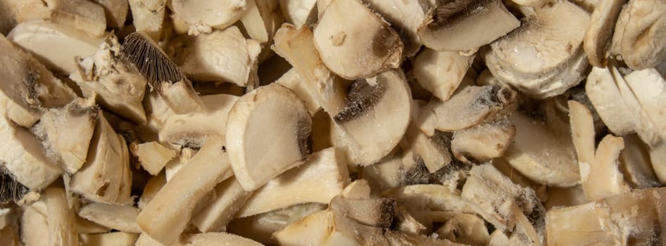 Background made of Frozen food sliced mushrooms champignon homemade. Harvesting concept. Stocking up vegetables for winter storage Healthy food, Cooking ingredients
