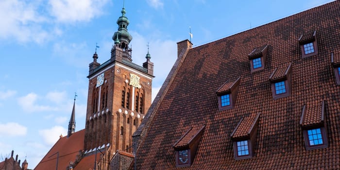 Gothic Church of St. Catherine in Gdansk Ancient architecture of old town in Gdansk Poland. Beautiful and colorful old houses historical part of downtown. Travel destination. Tourist attraction