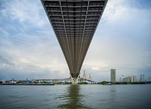 The bridge over the river On a cloudy day in the sky. Bhumibol Bridge, Samut Prakan, Thailand