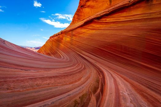 The Wave is a famous sandstone rock formation located in Coyote Buttes, Arizona, known for its colorful, undulating forms