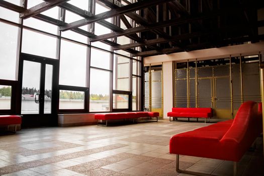 Red sofas and large windows in a modern room, bottom view