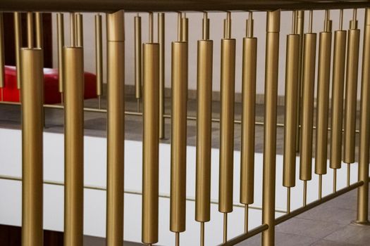 Close up metal railings of a golden balcony, background or texture