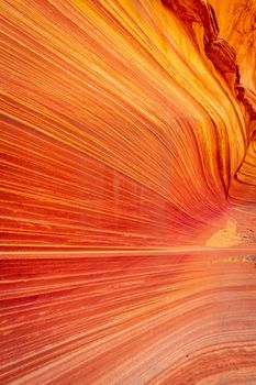 The Wave is a famous sandstone rock formation located in Coyote Buttes, Arizona, known for its colorful, undulating forms