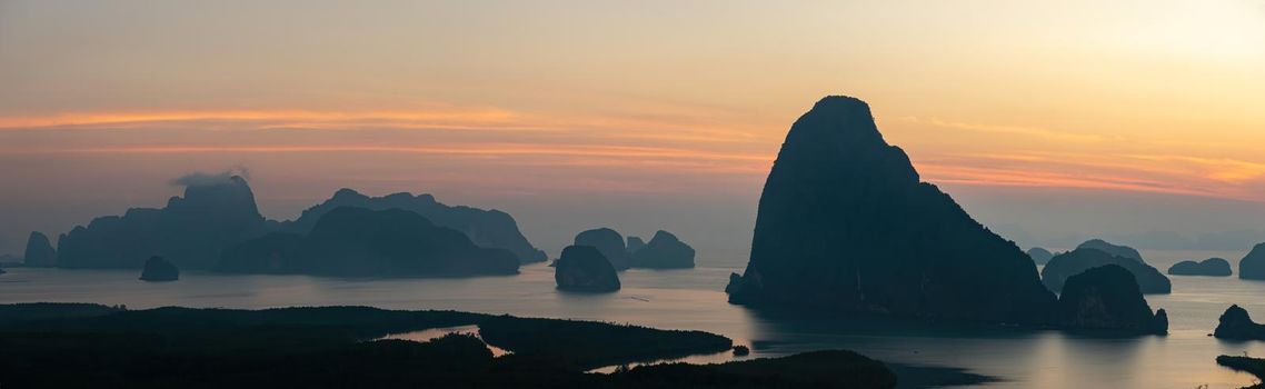 Panorama Morning sunrise. Mountains in the Andaman Sea. March 2019: Samed Nang Phi Phang Nga, Thailand