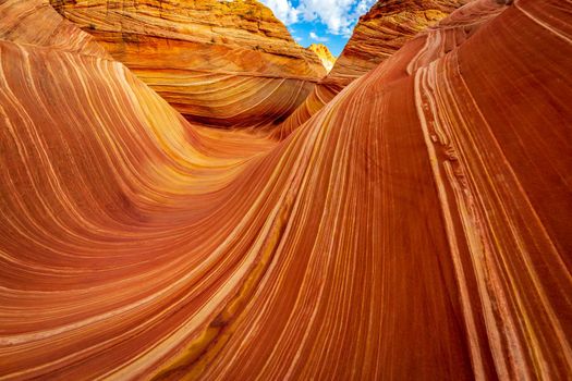 The Wave is a famous sandstone rock formation located in Coyote Buttes, Arizona, known for its colorful, undulating forms