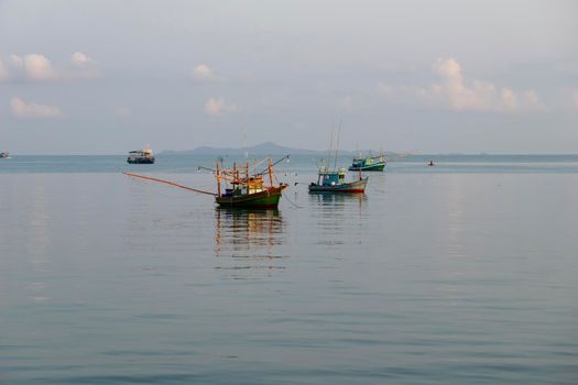 A small fishing boat is anchored. Stop back from Fishing near the coast
