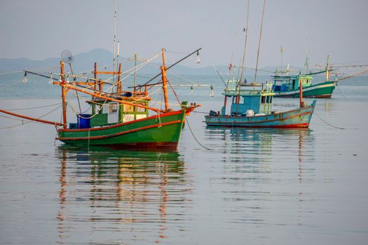 A small fishing boat is anchored. Stop back from Fishing near the coast