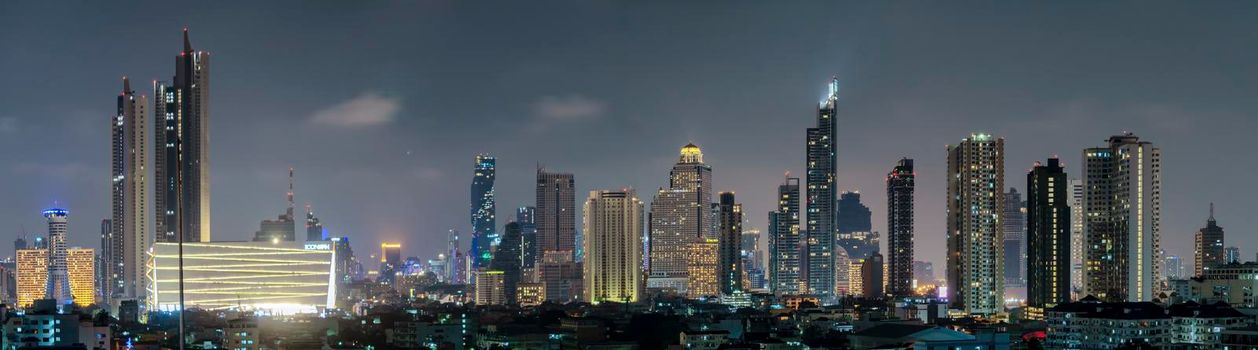 High-rise building in the capital city of Thailand Bangkok office area Night light from the building	
