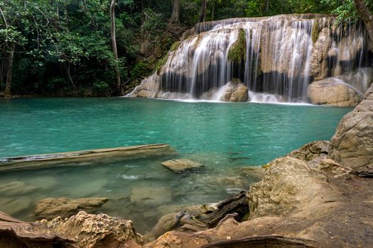 Clean green emerald water from the waterfall Surrounded by small trees - large trees,  green colour, Erawan waterfall, Kanchanaburi province, Thailand