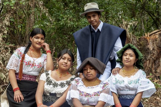 Family of five indigenous people, 4 women and a man from otavalo, ecuador with traditional. High quality photo