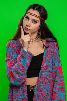Woman shakes finger and saying No, be careful, scolding and giving advice to avoid danger mistake, disapproval sign, quarreling. Girl isolated on chroma key background, green screen. People lifestyles