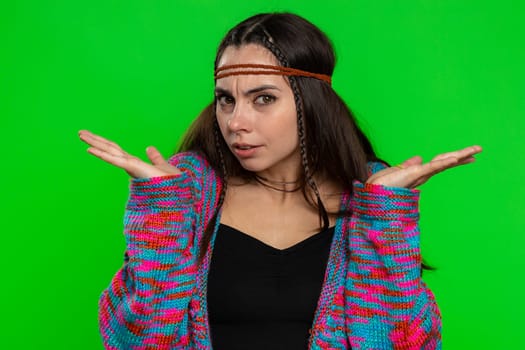 What Why. Sincere irritated woman raising hands in indignant expression ask reason of failure demonstrating disbelief irritation by trouble. Confused hippie girl on chroma key background, green screen