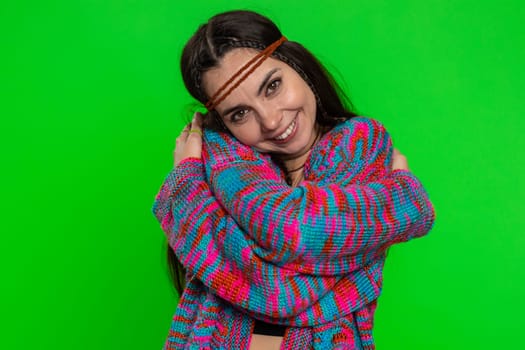 Come to me I want to embrace you. Young happy woman spread hands and give hug to you, invite. Pleasant expression love feelings. Hippie girl isolated on chroma key background, green screen, indoors