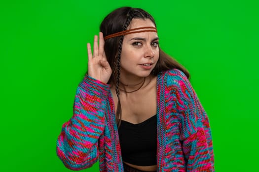 I cant hear you. What. Young woman trying hear, looking confused, frowning, keeping arm near ear for louder voice, asking to repeat, to hear information, deafness. Girl on green chroma key background