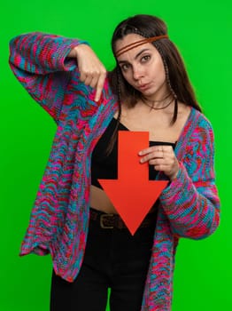 Upset woman showing red arrow pointing down, concept of downgrade, unsuccessful business, fall of stock market money exchange rate bankruptcy fail. Girl isolated on chroma key background, green screen