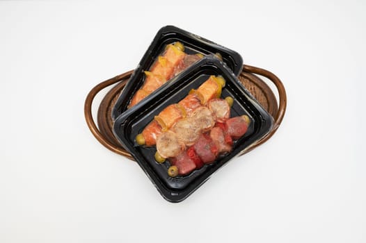 Meat with spices in a vacuum package for cooking suvid