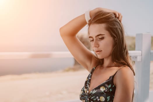 Happy woman portrait in cafe. Boho chic fashion style. Outdoor photo of young happy woman with long hair, sunny weather outdoors sitting in modern cafe